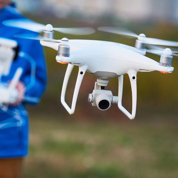 A close-up photo of a drone flying at Carroll University.